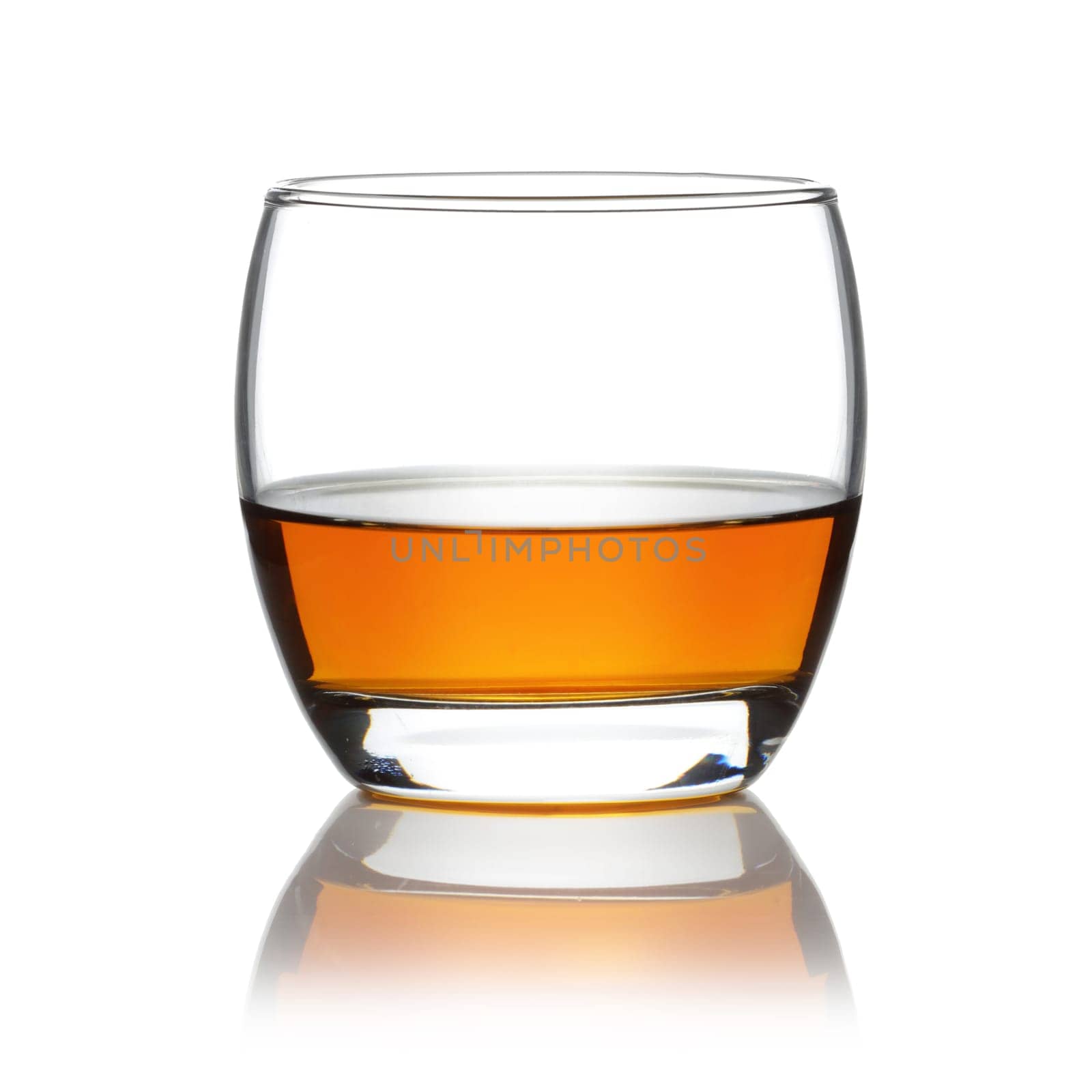 A Scotch in a round tumbler isolated on white