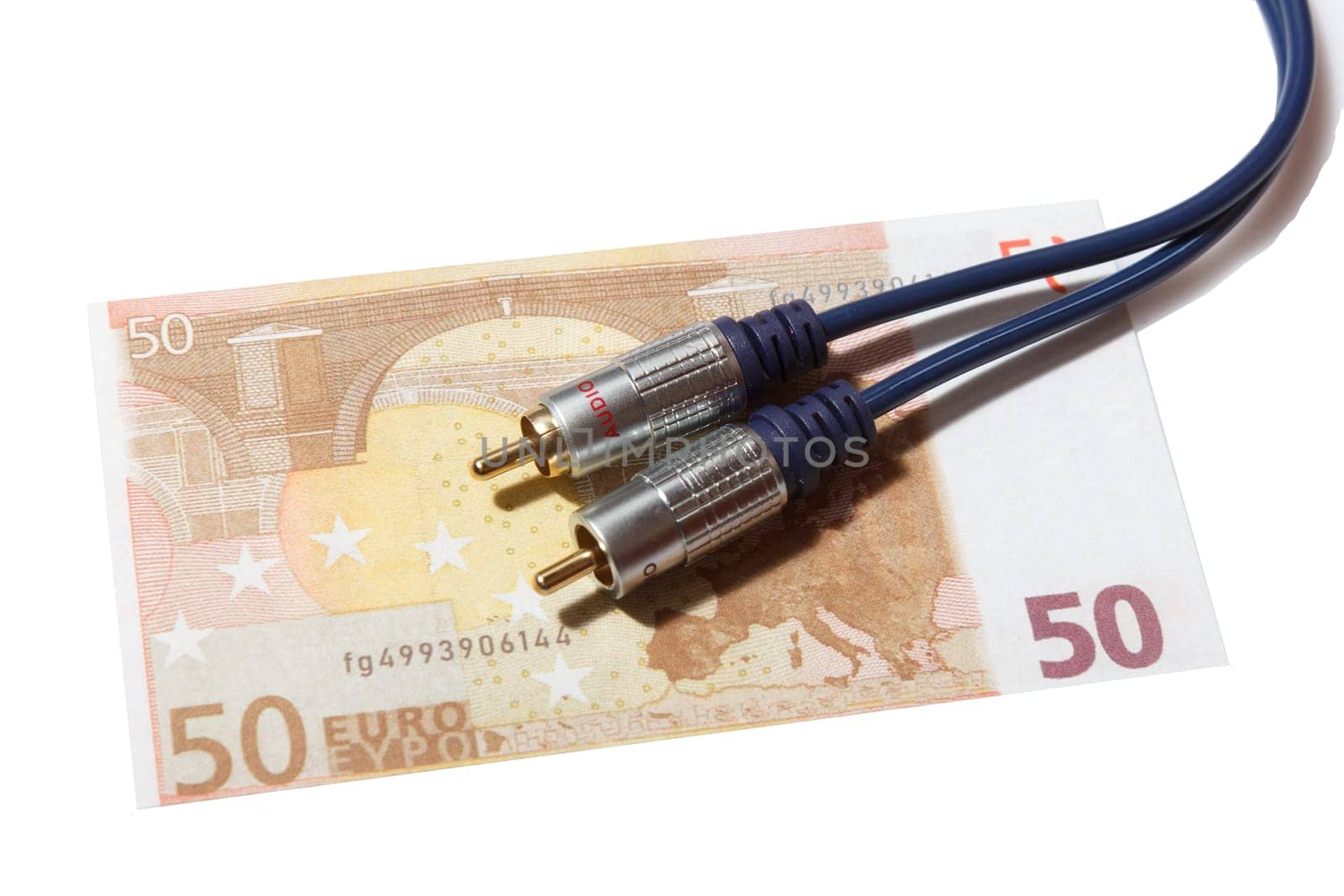 Audiophile concept. Stereo audio cable on banknotes.