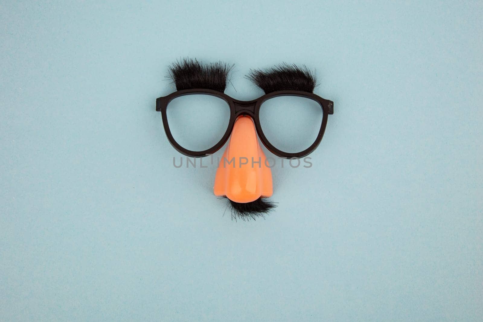 Funny Mask with Eyes and Nose on light blue Background