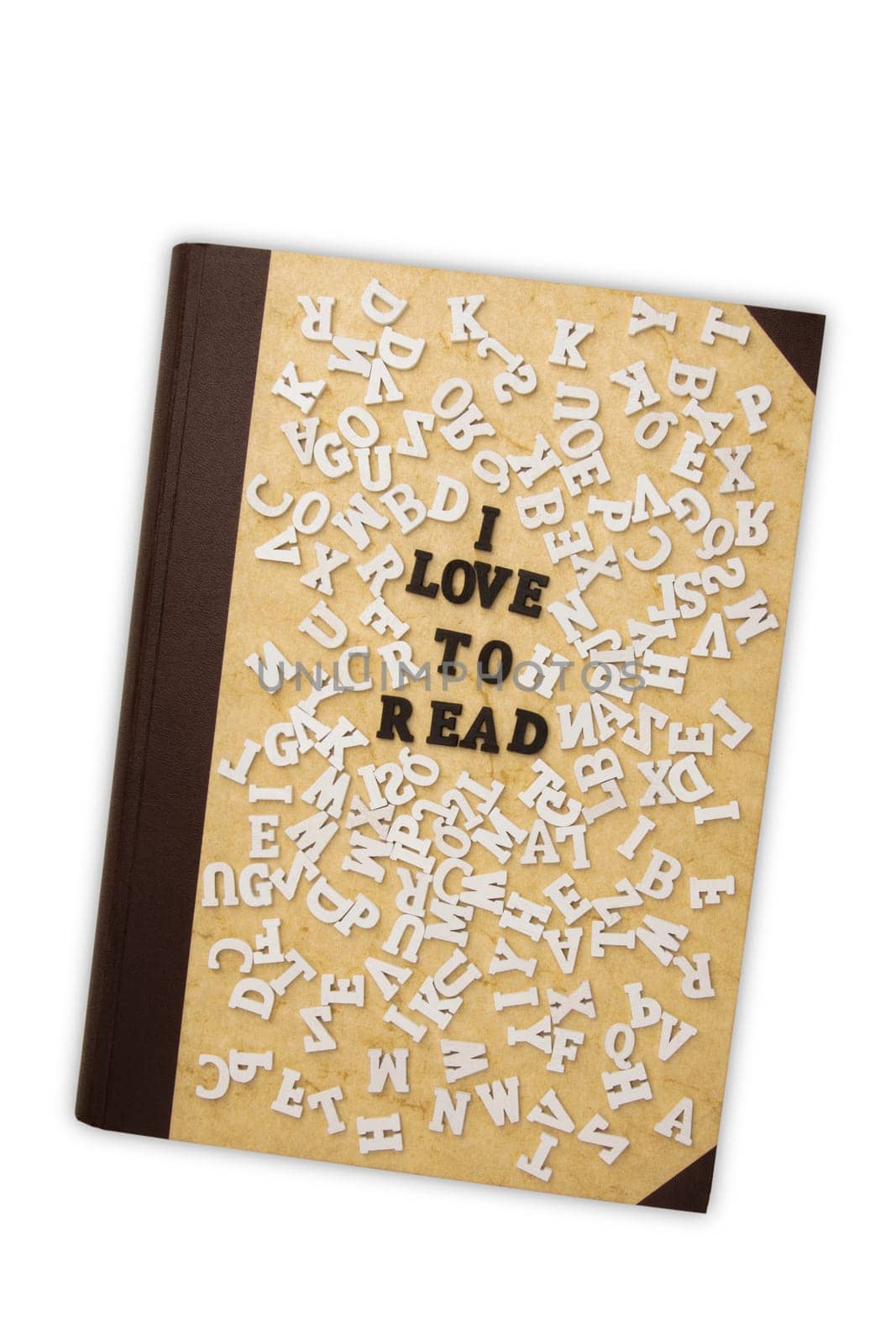 Concept I Love to read with Toy Letters and a old Book on white background