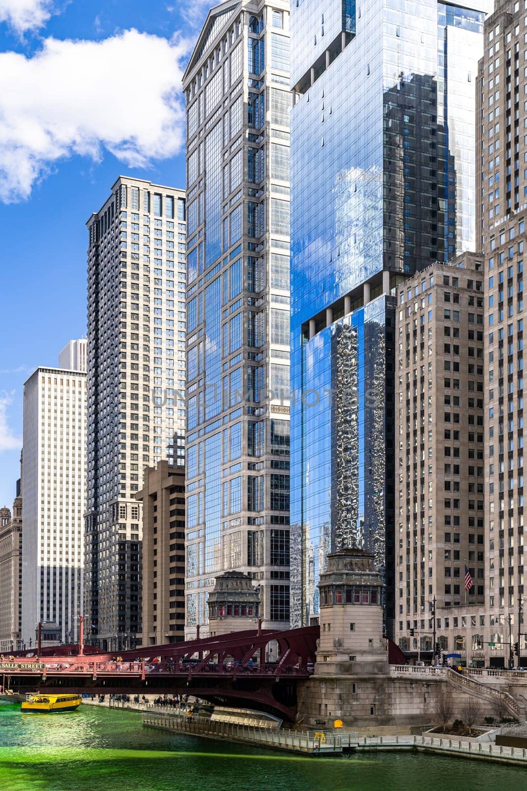 Chicago Skylines building along green dyeing river of Chicago River on St. Patrick day festival in Chicago Downtown IL USA