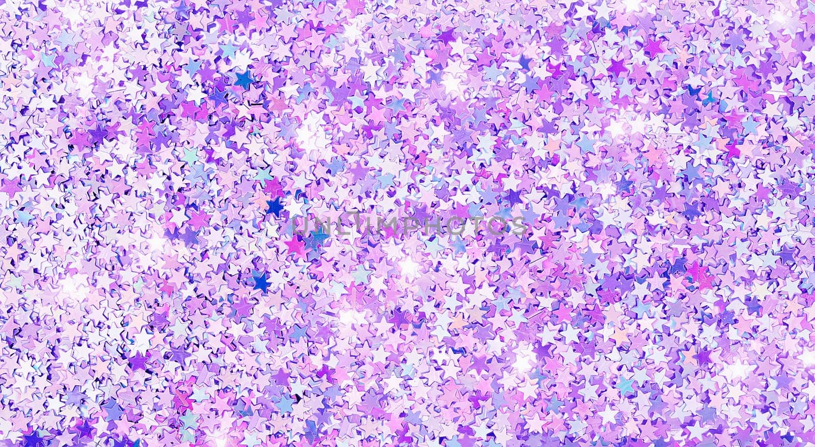 Real shiny five pointed star shape sparkles textured background