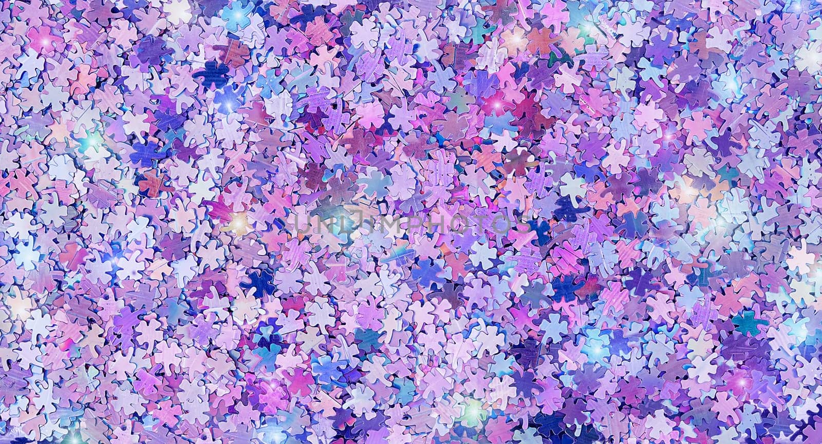 Real shiny four leaf clover shape sparkles textured background