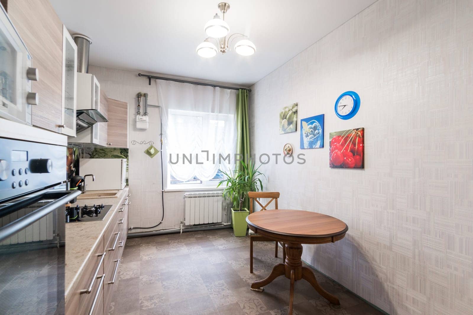 Russia, Moscow- June 11, 2019: interior room apartment. standard repair decoration in hostel. kitchen and dining room