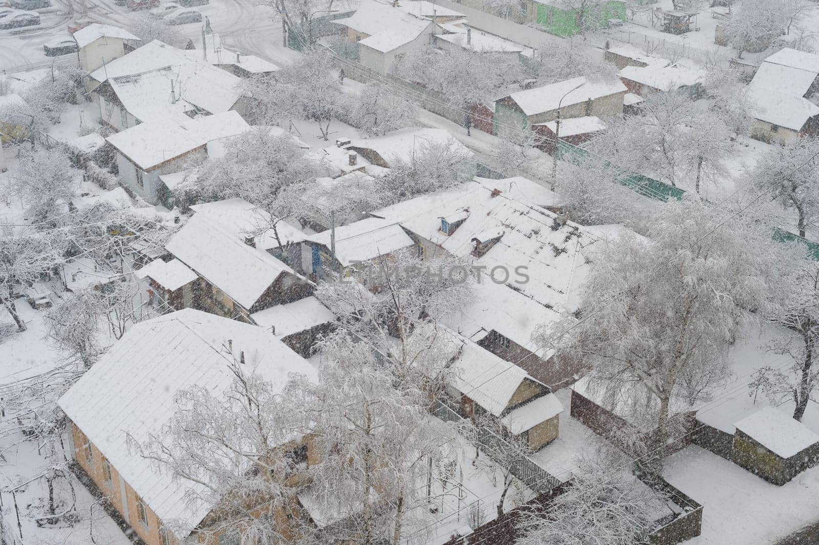 Aerail view of residential area and privat buildings in snowfall winter day, Kiev, Ukraine