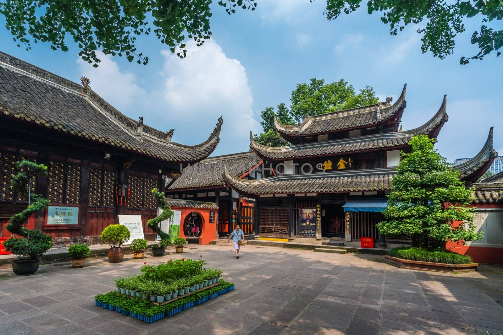 Chengdu, China -  July 2019 : Pilgrim or tourist walking in the courtyard of the Buddhist Wenshu Monastery, Chengdu, Sichuan Province