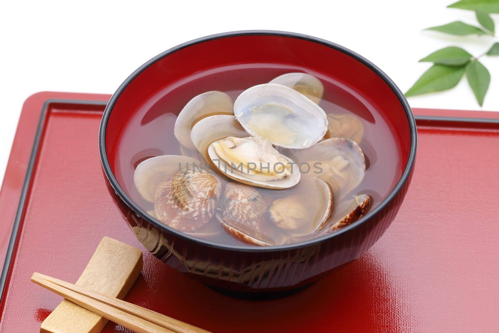 Japanese soy sauce soup with asari clams in a bowl on tray