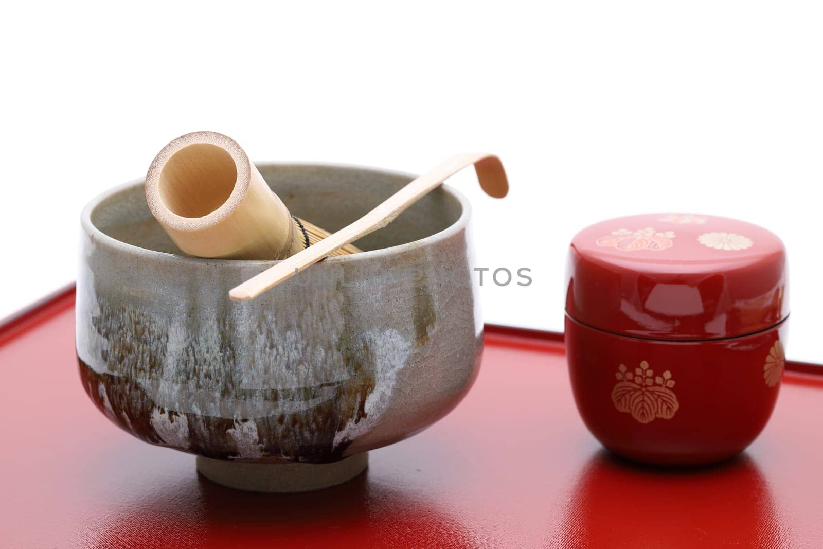 Tea bowl with tea whisk and bamboo spoon used in Japanese matcha green tea ceremony