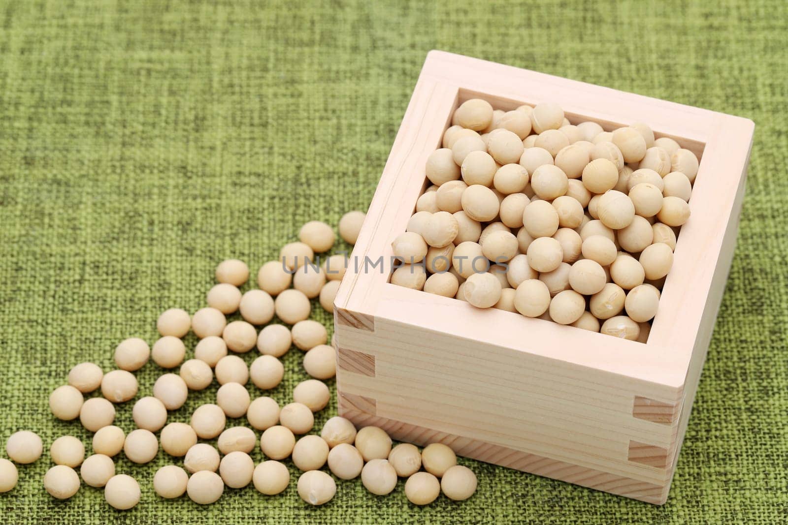 Japanese soybeans daizu in a wooden masu