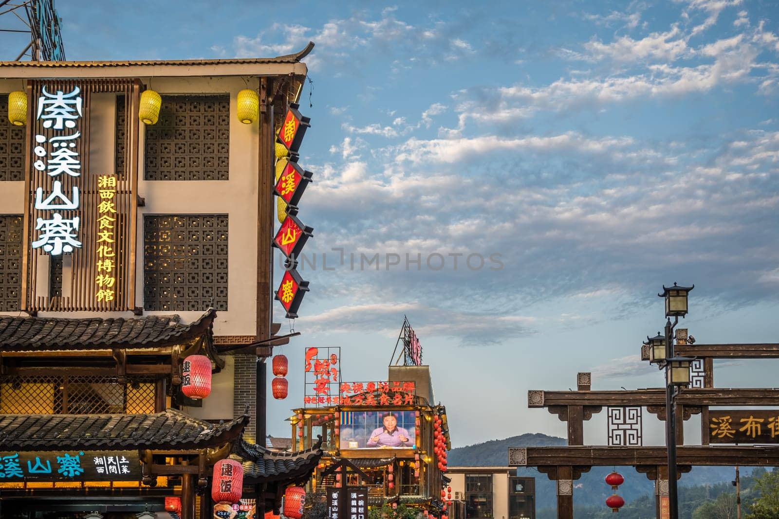 Wulingyuan, China - August 2019 : Neons, lanterns and facades of hotels, shops and restaurants in touristic part of town