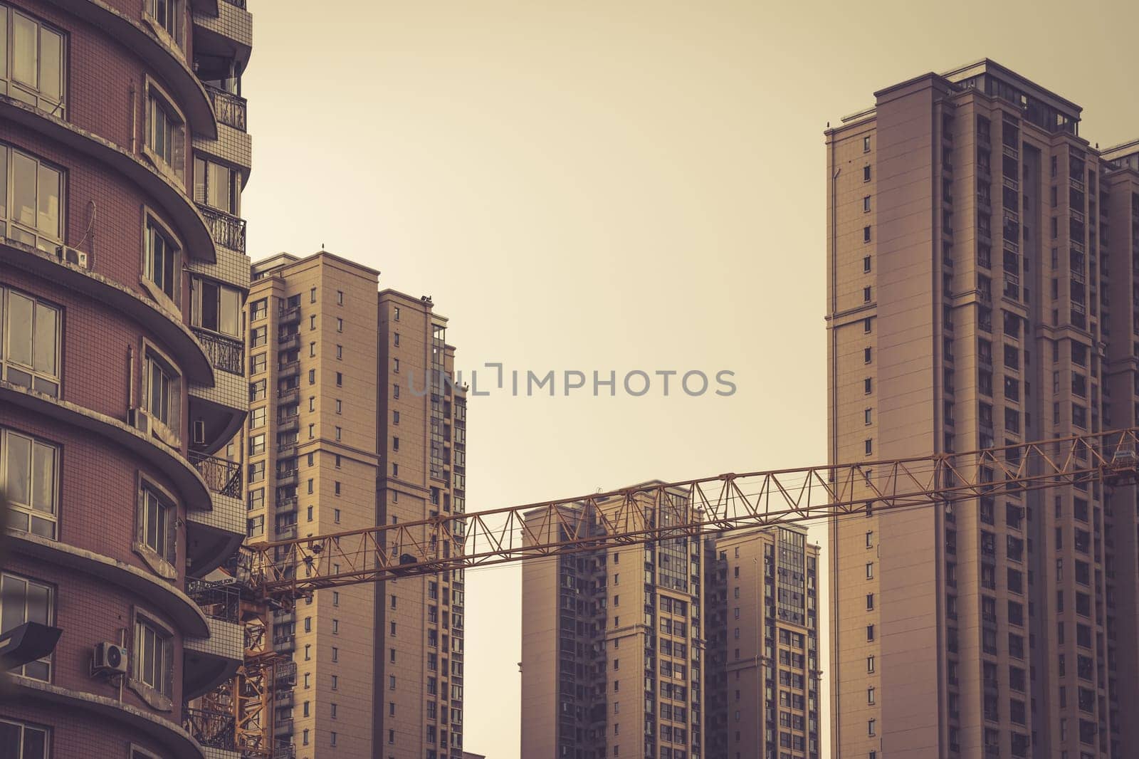 Chengdu, China -  July 2019 : Cranes on the building site of brand new high rise living apartments in the centre of Chengdu, Sichuan Province