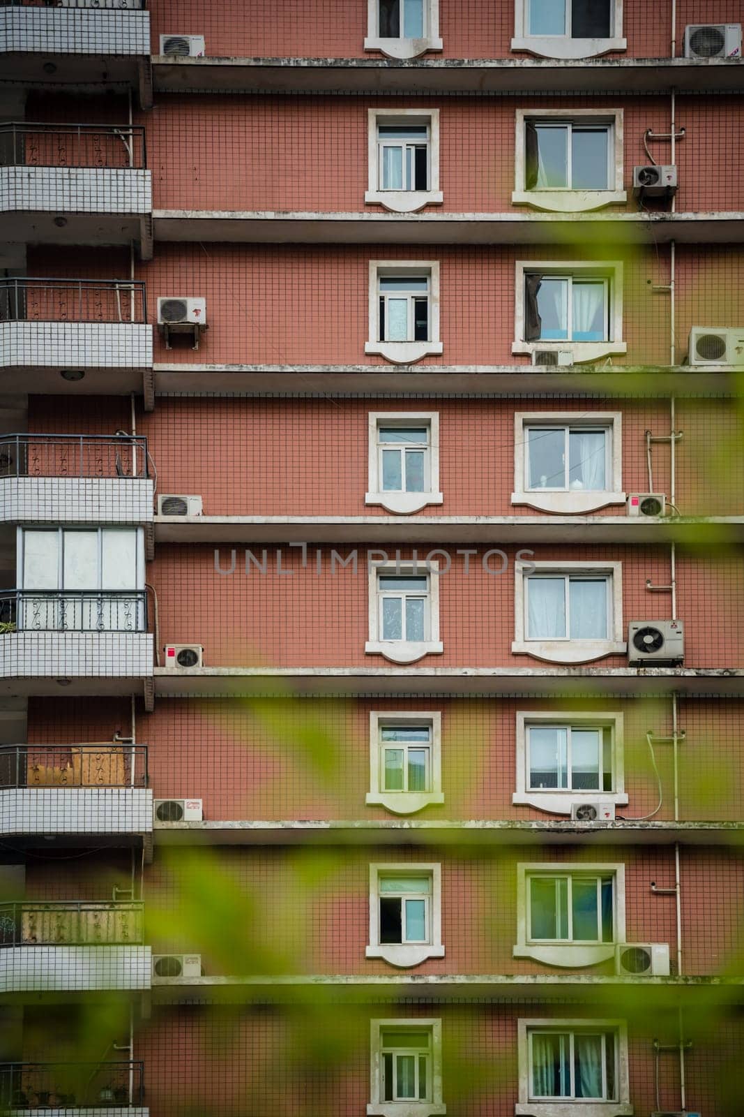Chengdu, China -  July 2019 : Windows and balconies in high residential building and block of flats