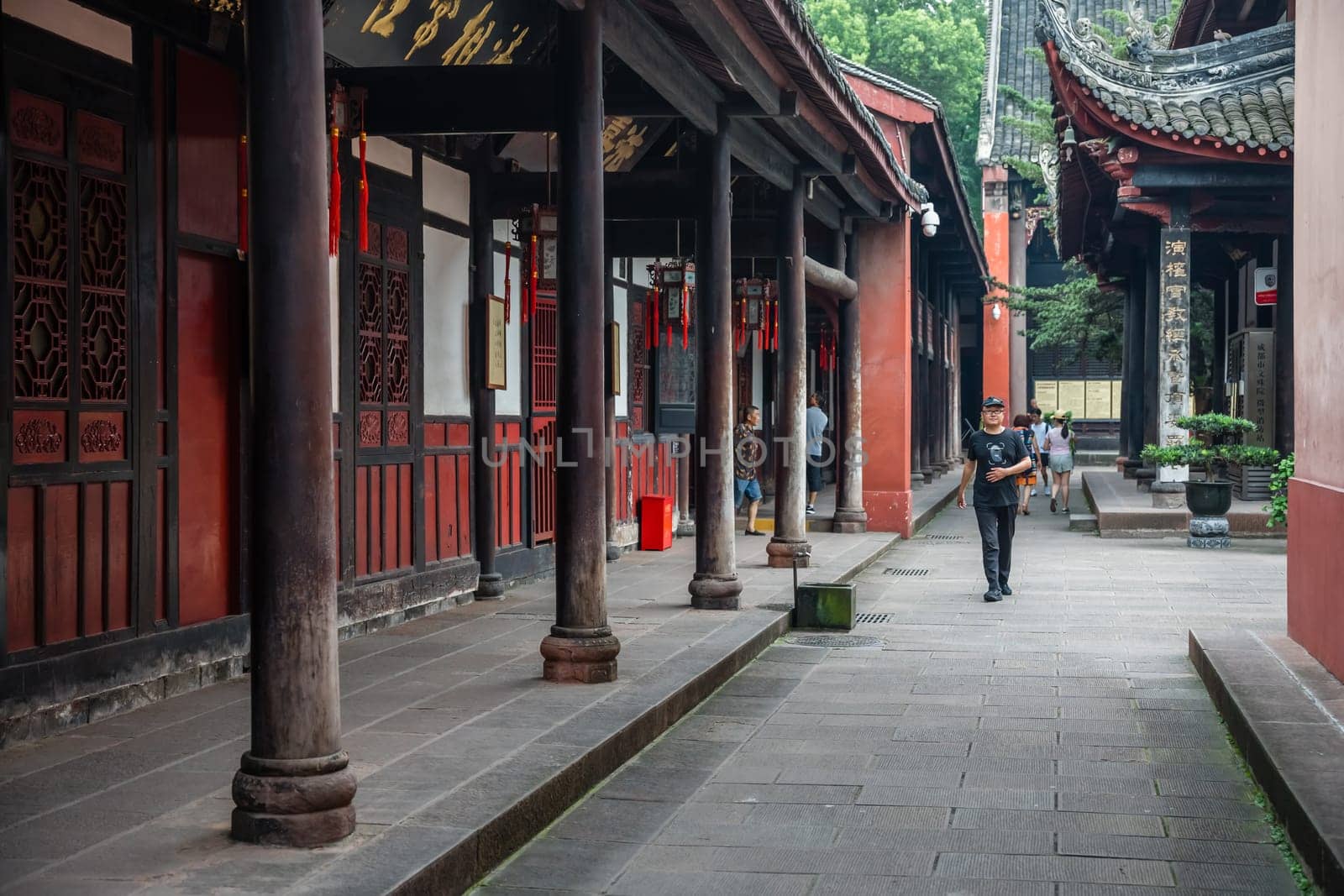 Chengdu, China -  July 2019 :  Tourists walking in a courtyard and walking path in Wenshu Monastery
