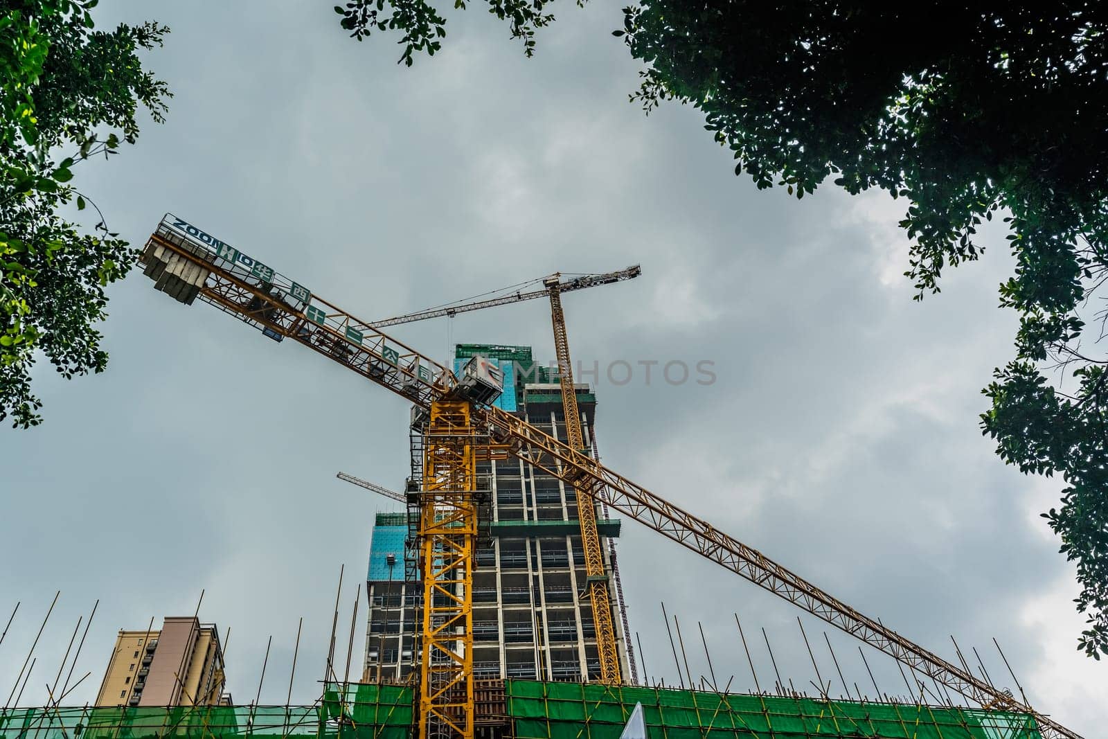 Chengdu, China -  July 2019 : Cranes on the building site of brand new high rise living apartments in the centre of town, Sichuan Province