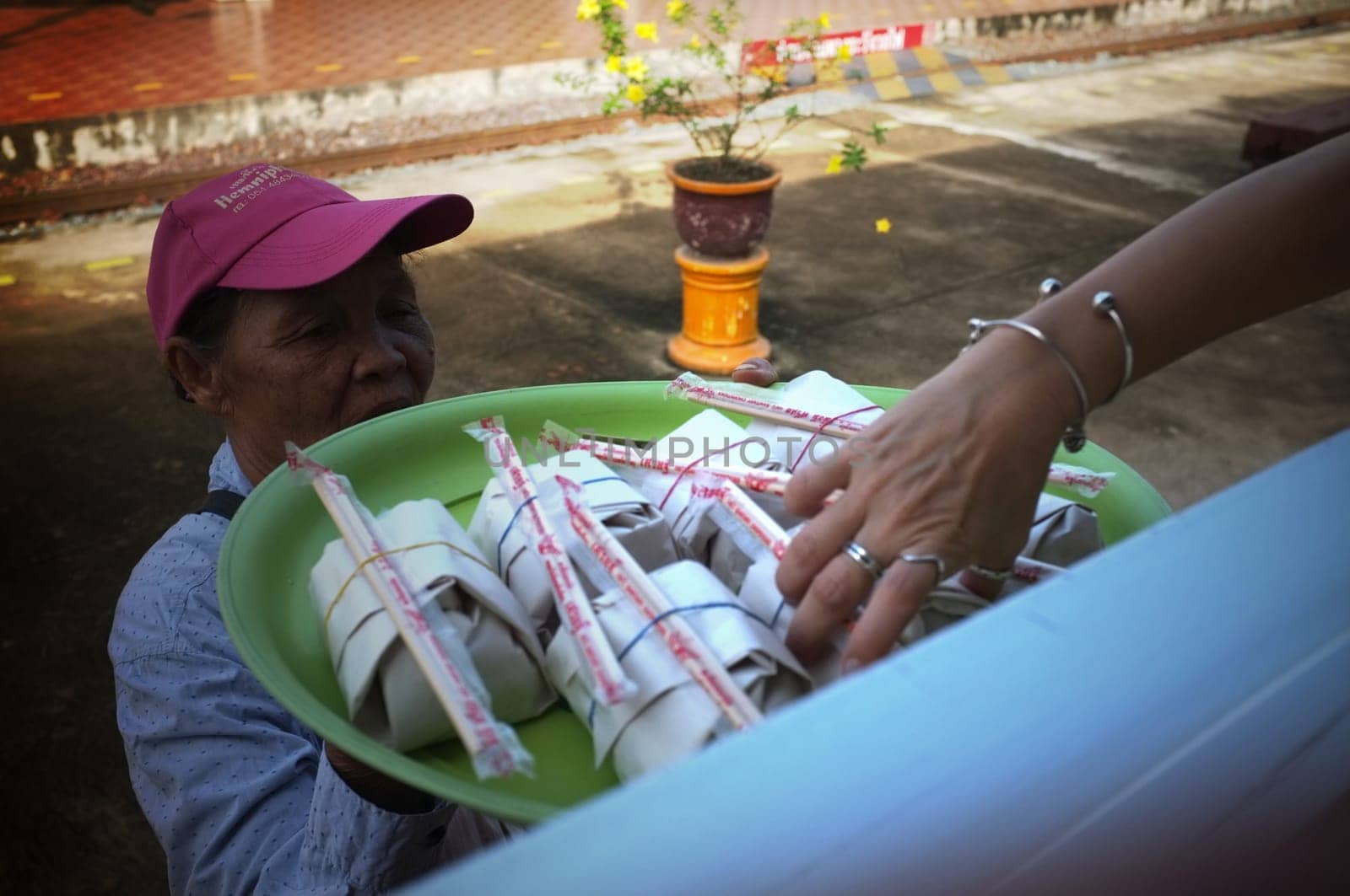Phrae  , Thailand : September 13 2019 : The vendor on the Thai train sell Red pork noodles at Ban Pin Railway Station