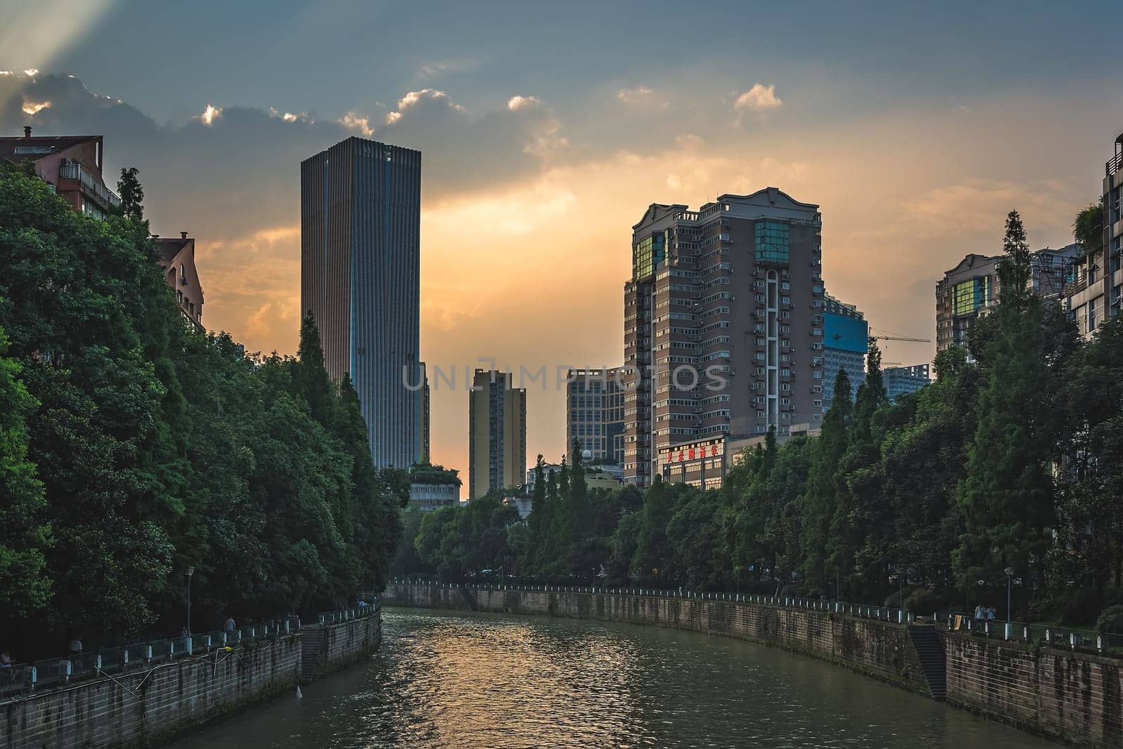 Chengdu, China -  July 2019 : Jin River flowing through Chengdu city at dusk, Sichuan Province