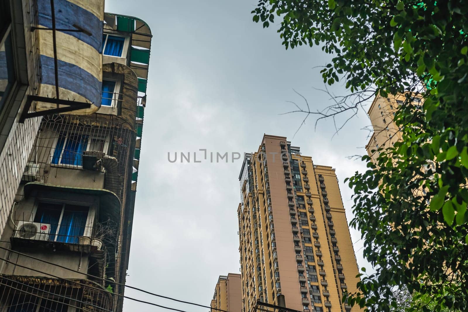 Chengdu, China -  July 2019 : View of the old andnew high rise living apartments in the centre of town, Sichuan Province