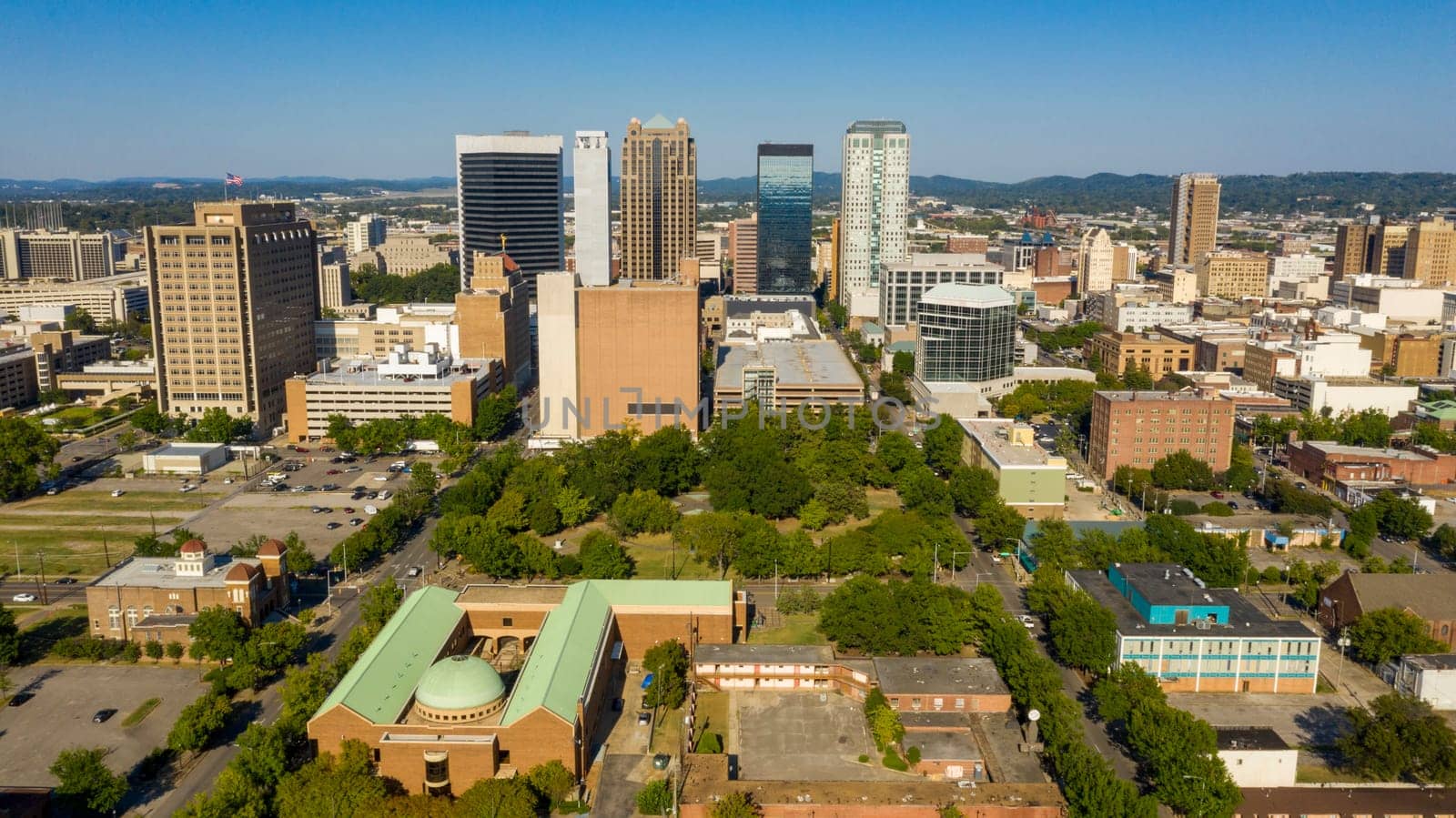 Flags fly over the rooftops and street of the southern downtown Birmingham Alabama