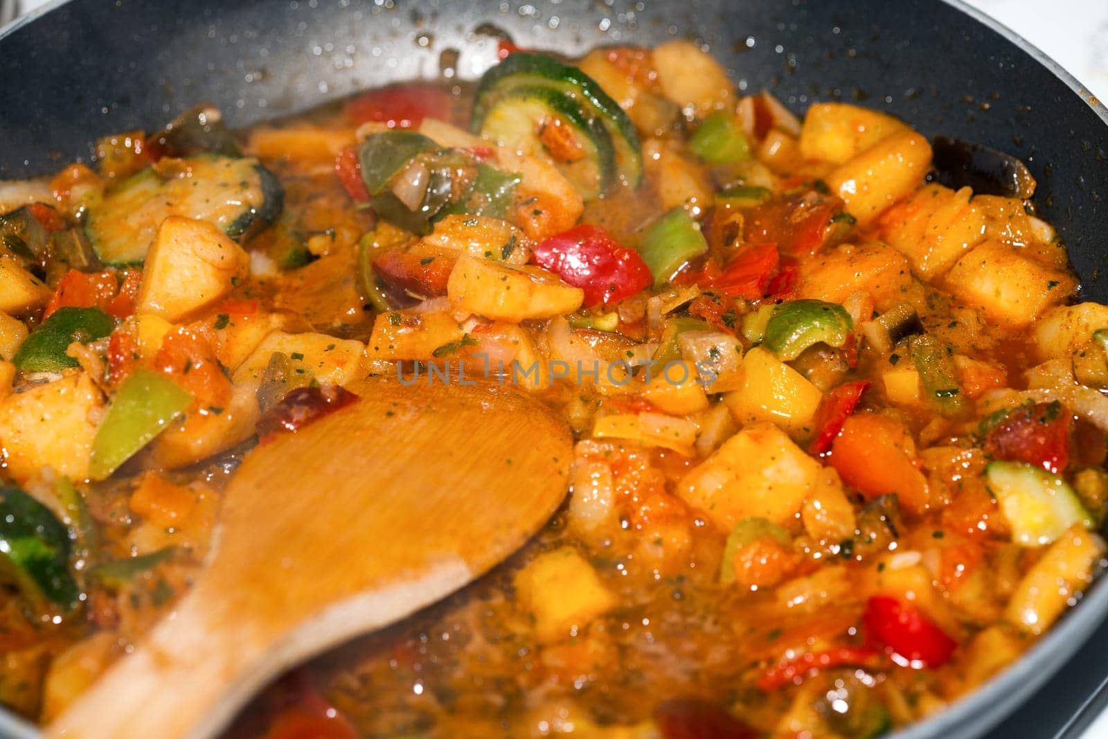 Ratatouille is a French Provencal stewed vegetable dish, originating in Nice. Recipe ingredients include tomato, garlic, onion, zucchini, aubergine (eggplant), bell pepper, and some combination of leafy green herbs common to the region.