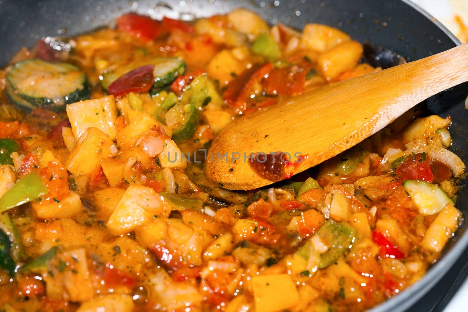 Ratatouille is a French Provencal stewed vegetable dish, originating in Nice. Recipe ingredients include tomato, garlic, onion, zucchini, aubergine (eggplant), bell pepper, and some combination of leafy green herbs common to the region.