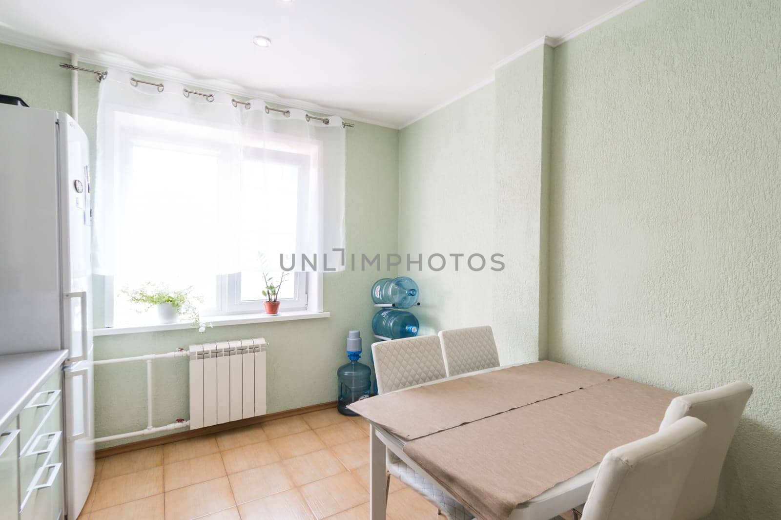 Russia, Moscow- June 11, 2019: interior room apartment. standard repair decoration in hostel. kitchen and dining room