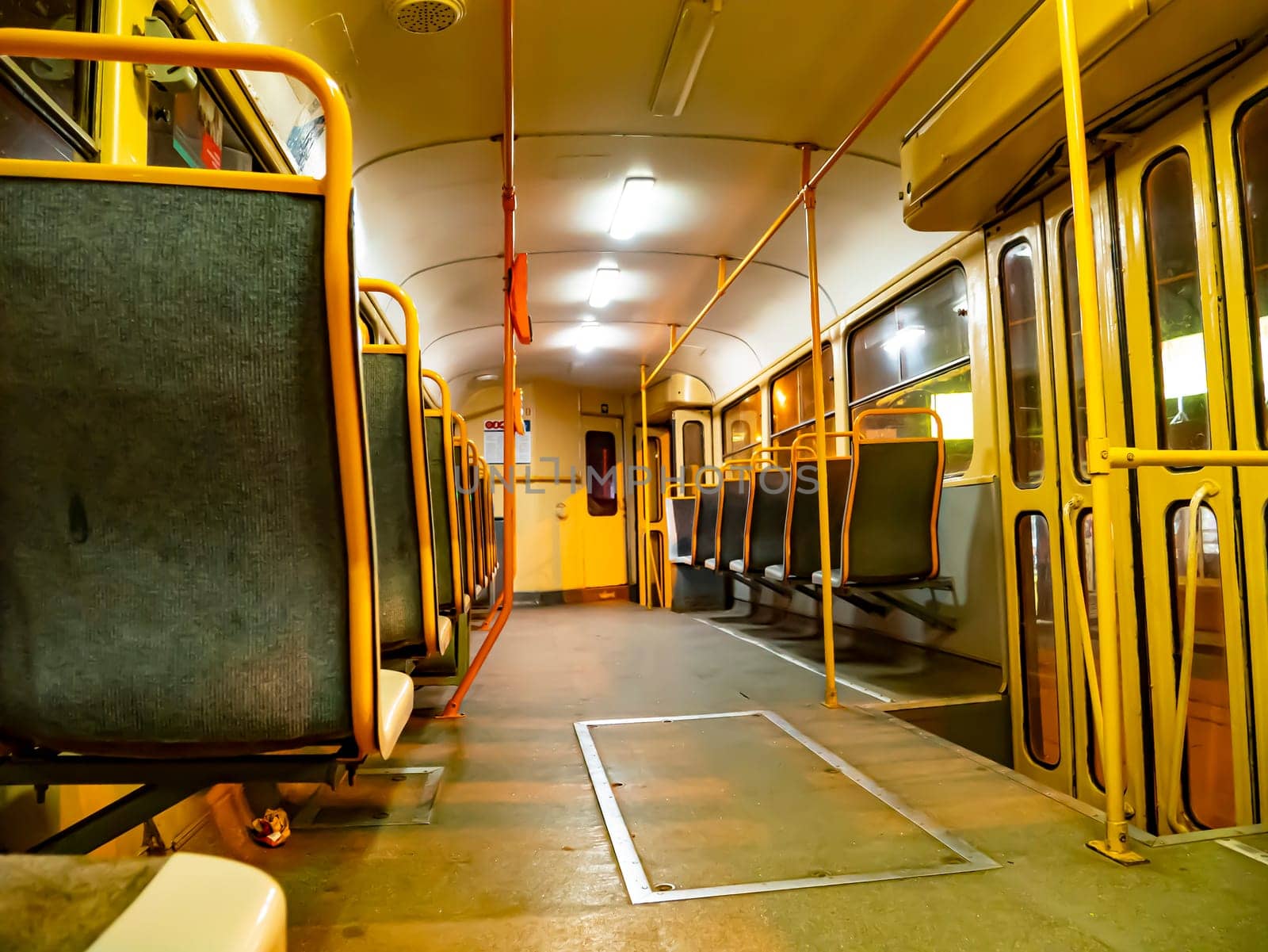 A tram car inside without people. Public transport.