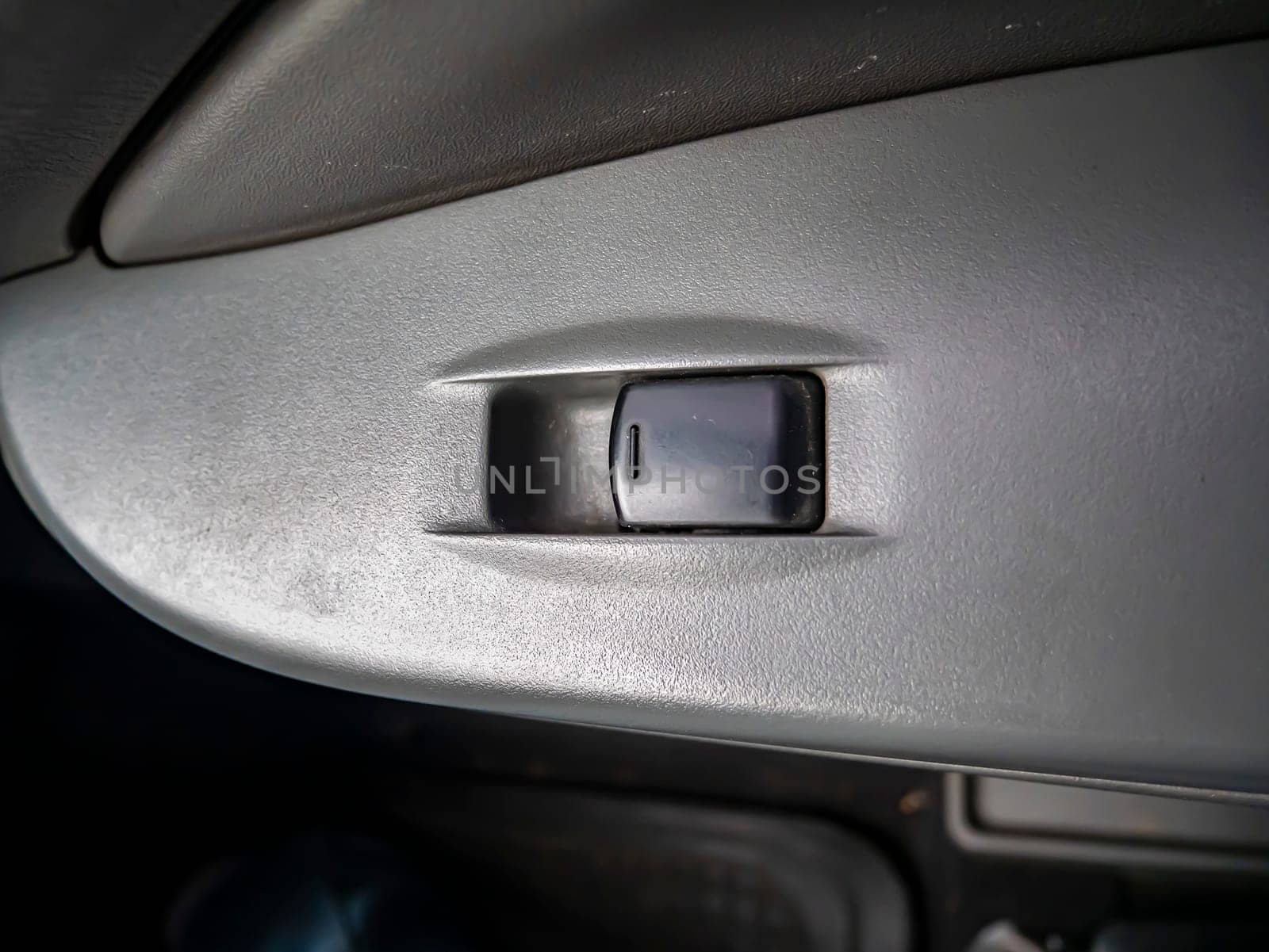 Power window button of a car. Place for text. Transport.