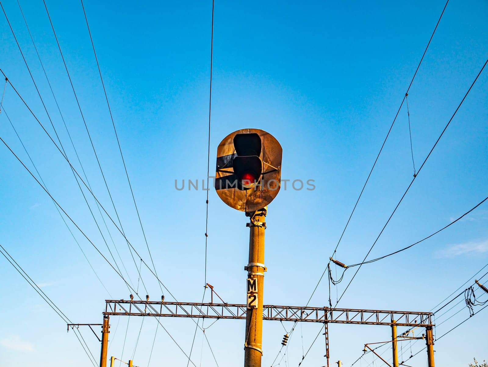 Railway traffic light of red color. Railway. Transport.