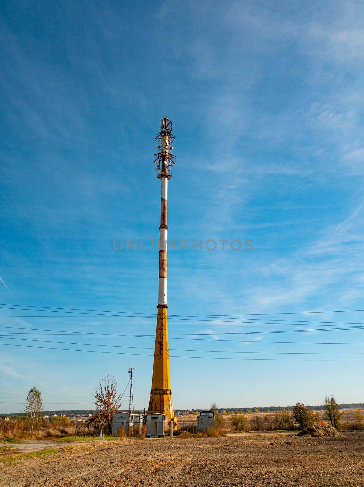 Mobile communications tower on a background of blue sky. Communications. Technologies.