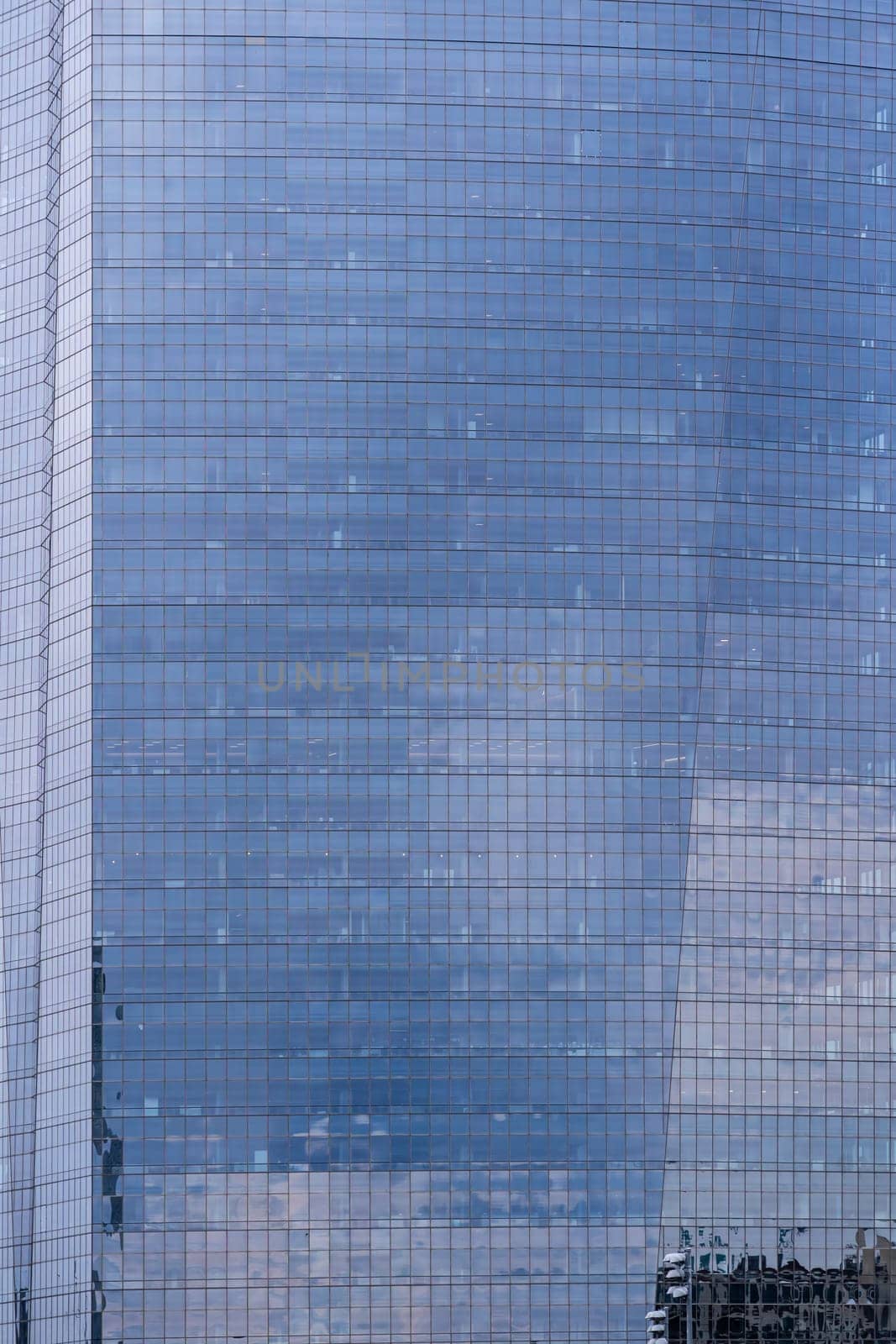 Urban abstract - window facade of business center office building with reflections and colours. Philadelphia PA USA