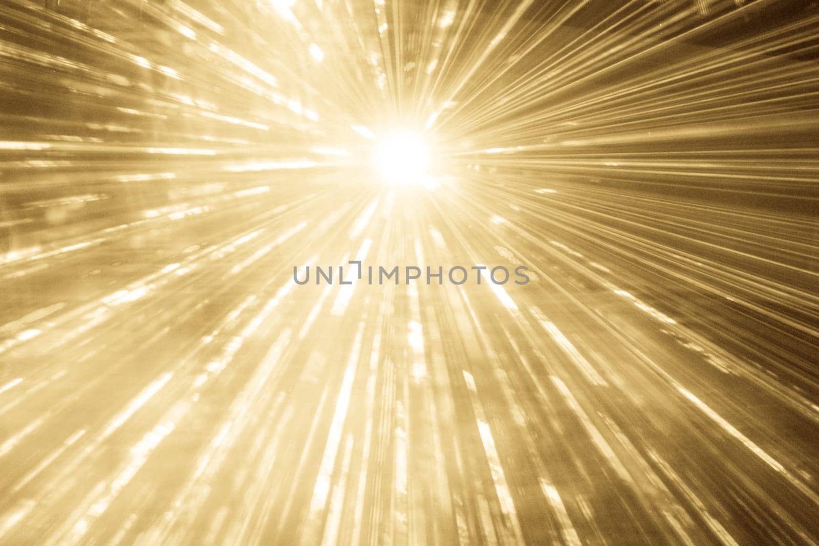 Luxury entertainment with bright light source and many beams and streams to every side at nightclub event, festival or New Year's Eve.