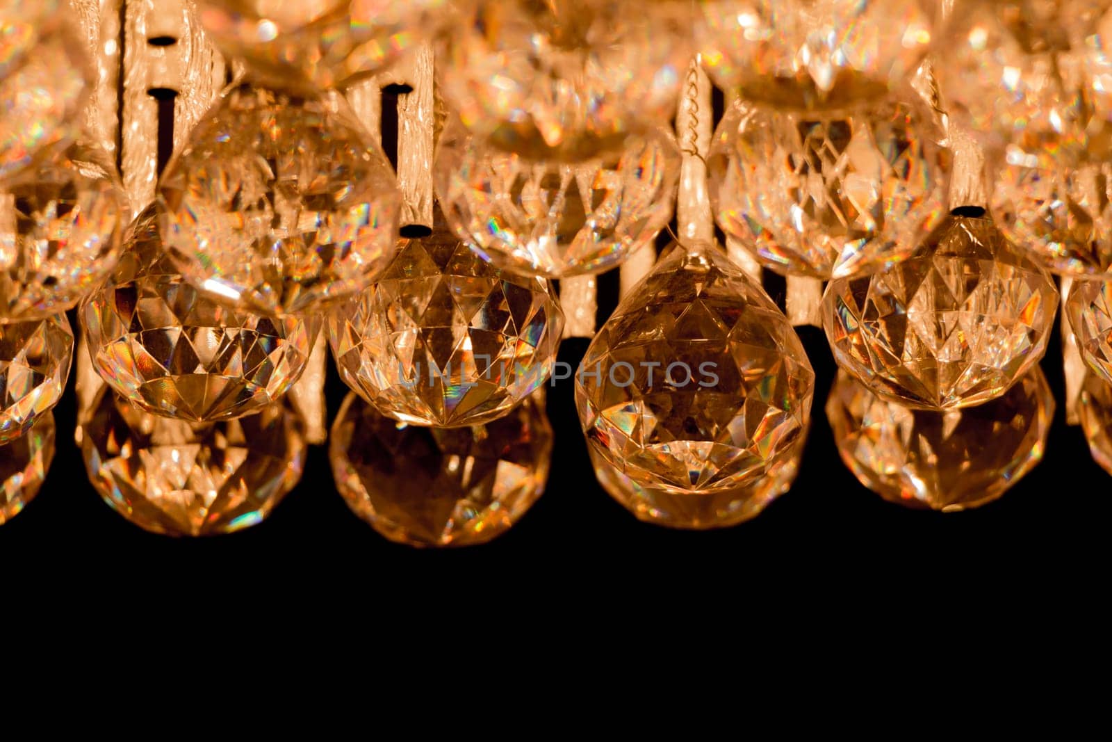 Noble candelabra hanging on ceiling with lots of little gems. Wealth decoration for palace gala, villa business meeting or wedding.