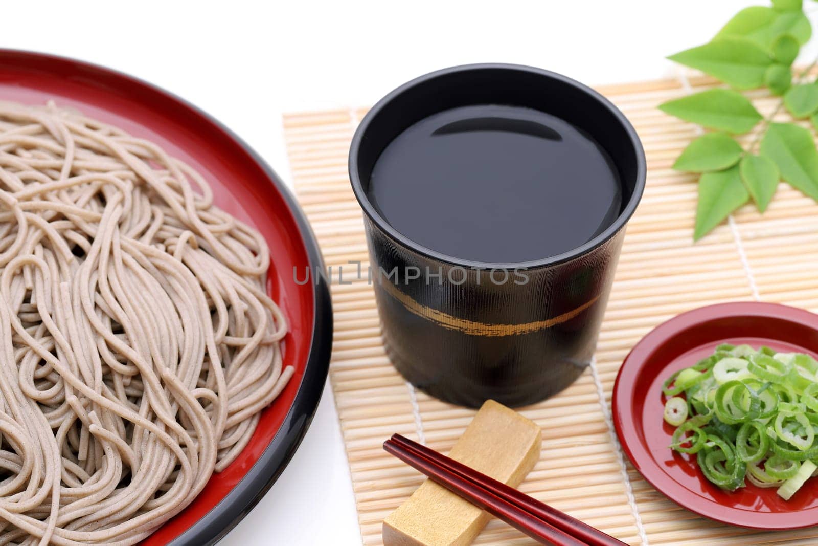 Japanese Zaru soba noodles on wooden plate on white background