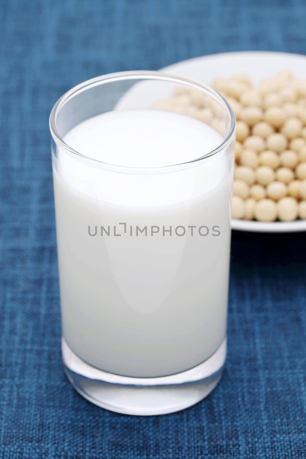 Glass of milk with soy bean on dining table