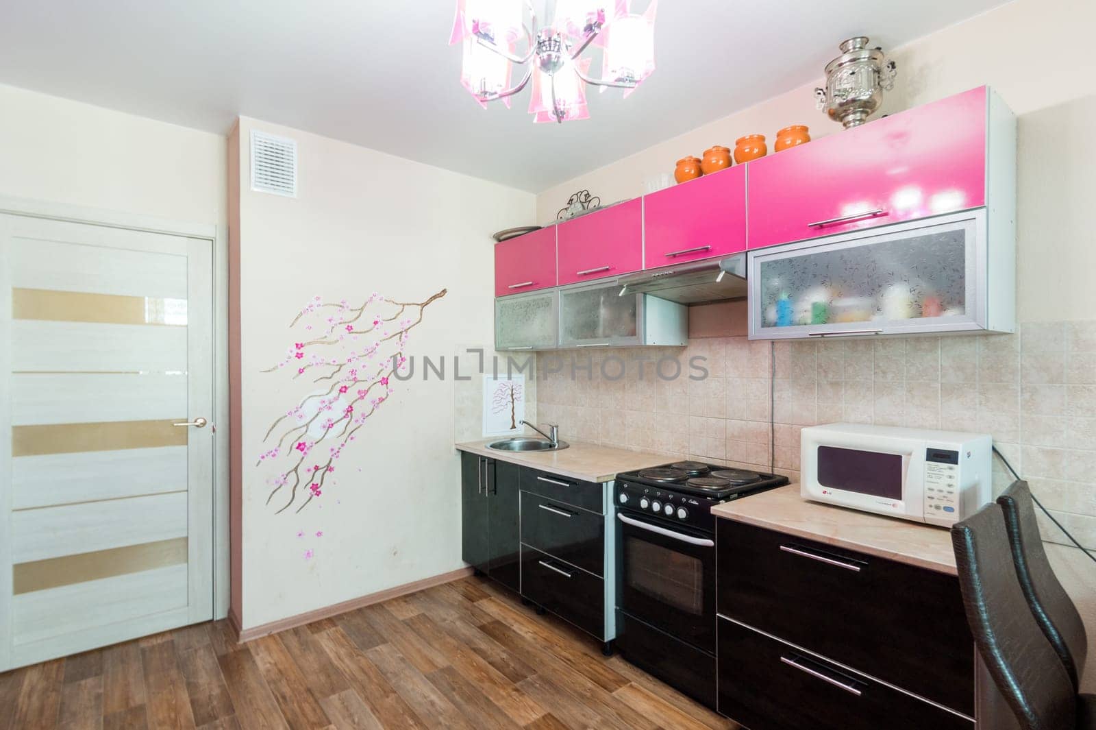 Russia, Moscow- June 11, 2019: interior room apartment. standard repair decoration in hostel. modern kitchen, dining area