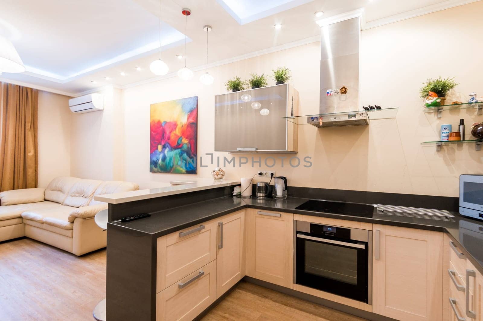 Russia, Moscow- June 11, 2019: interior room apartment. standard repair decoration in hostel. modern kitchen, dining area