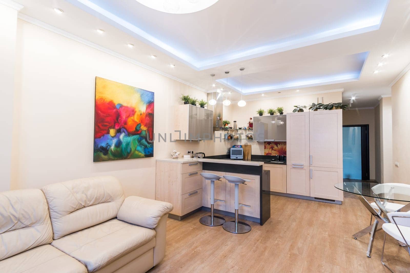Russia, Moscow- June 11, 2019: interior room apartment. standard repair decoration in hostel. modern kitchen, dining area