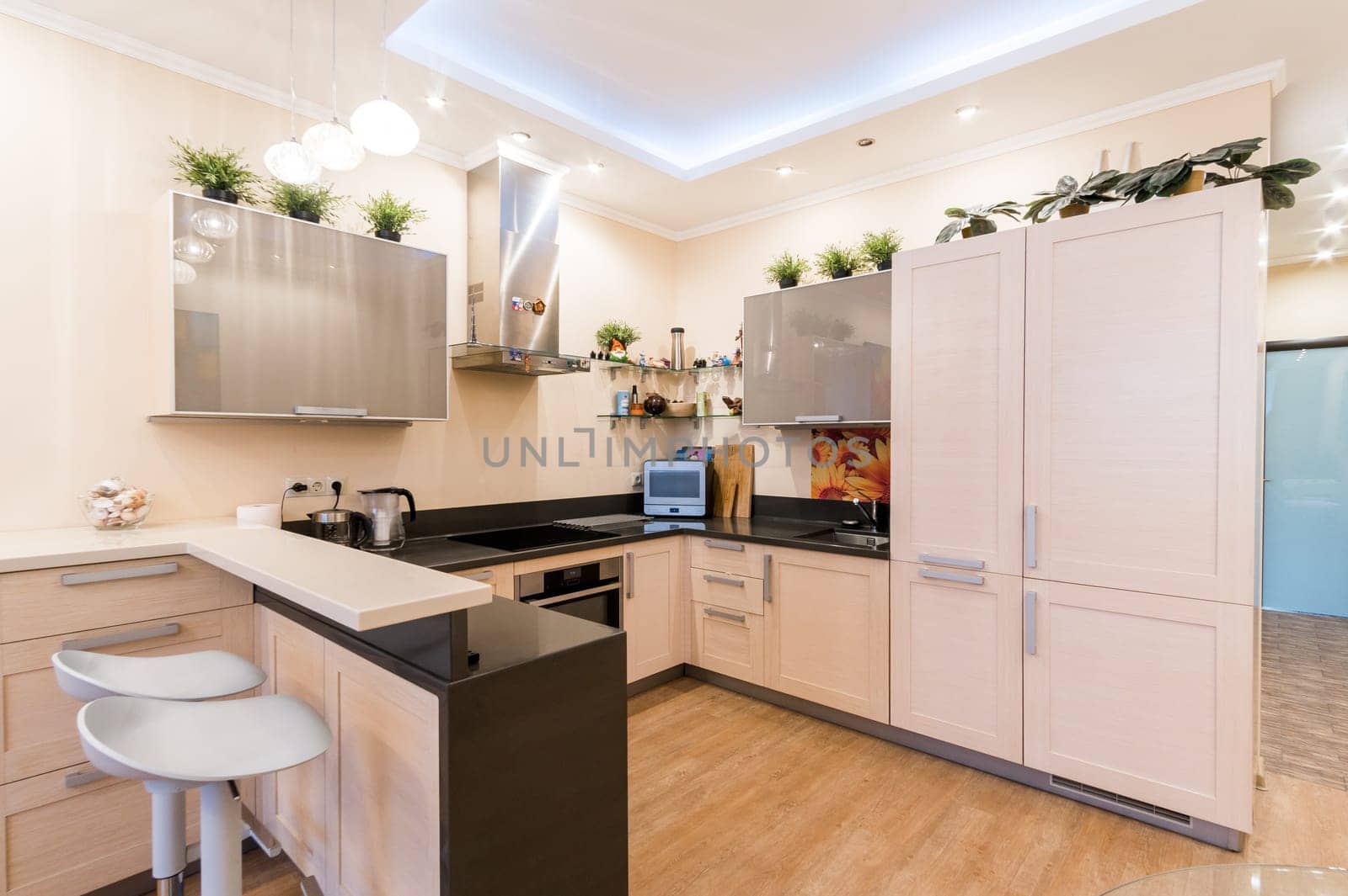 Russia, Moscow- June 11, 2019: interior room apartment. standard repair decoration in hostel. modern kitchen, dining area