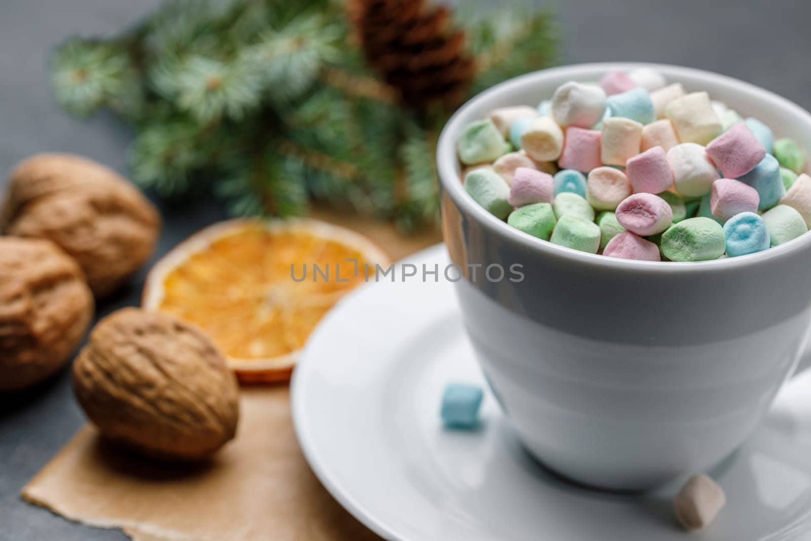 White cup with cocoa and Marshmello on a Christmas background with shallow depth of field