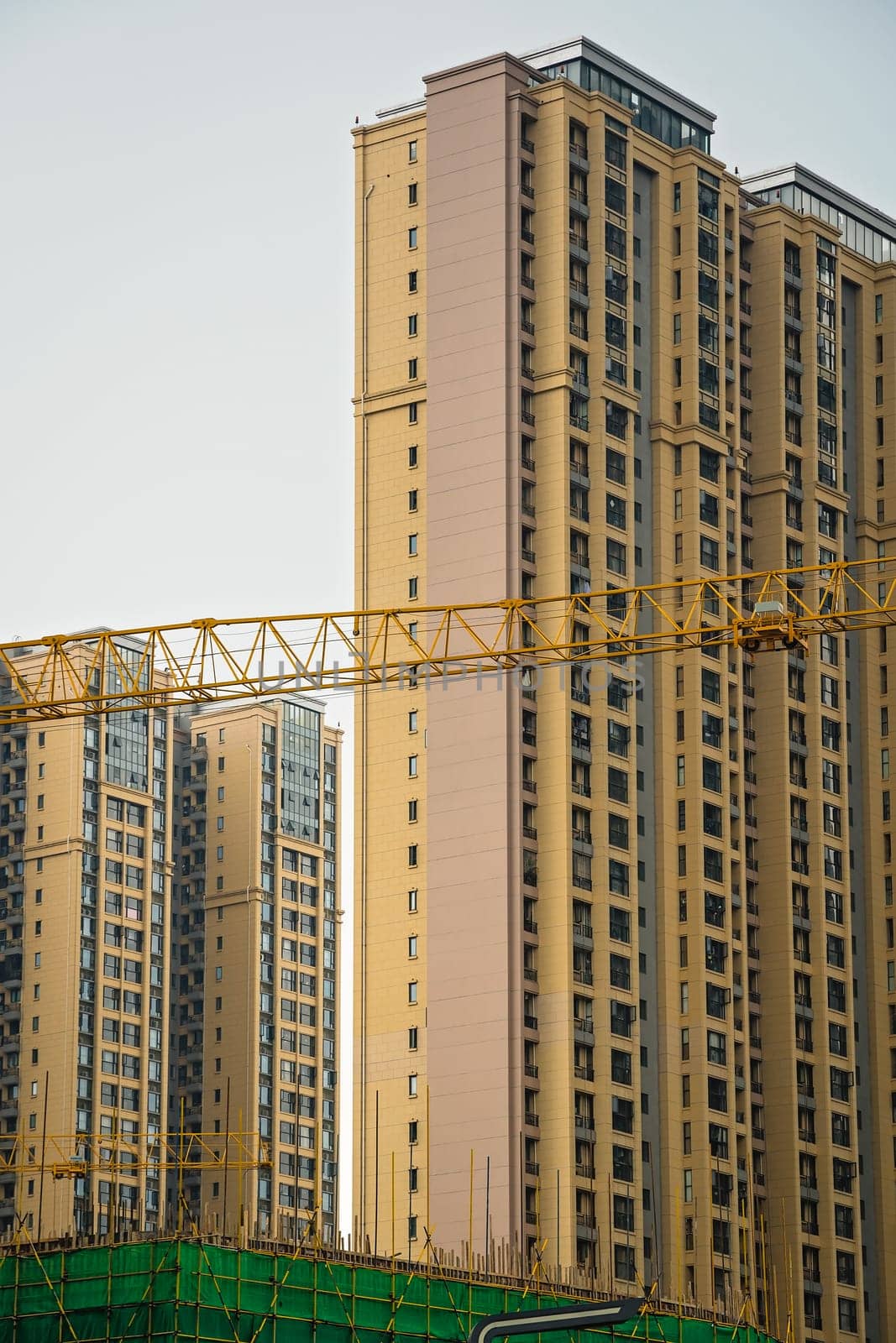 Cranes on the building site of brand new high rise living apartments in the centre of Chengdu, Sichuan Province, China