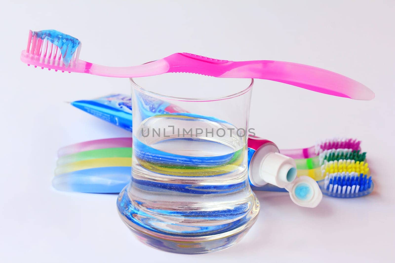 Healthy, well-kept teeth by brushing with toothbrushes and toothpaste