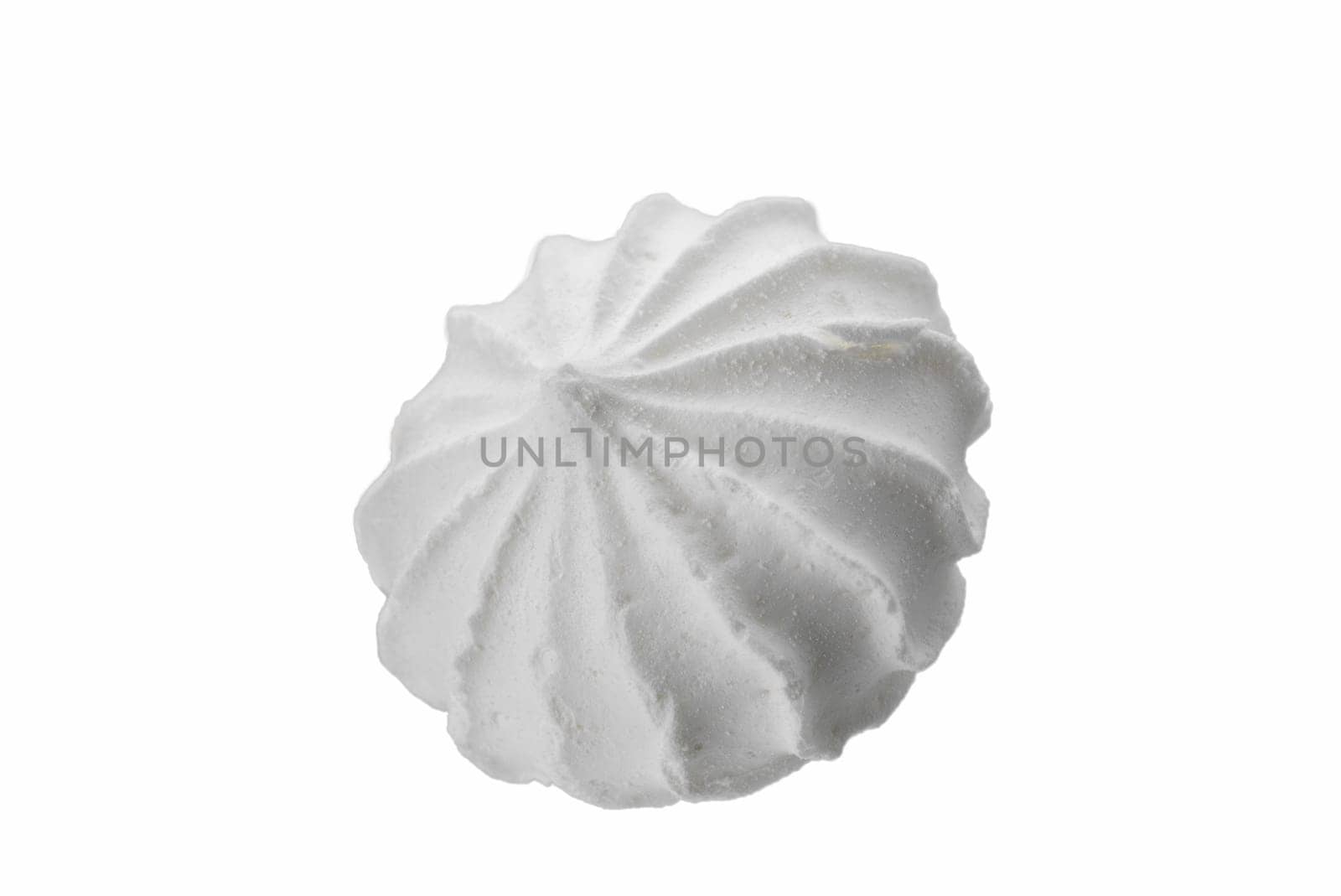 Levitating white meringues closeup on a white background