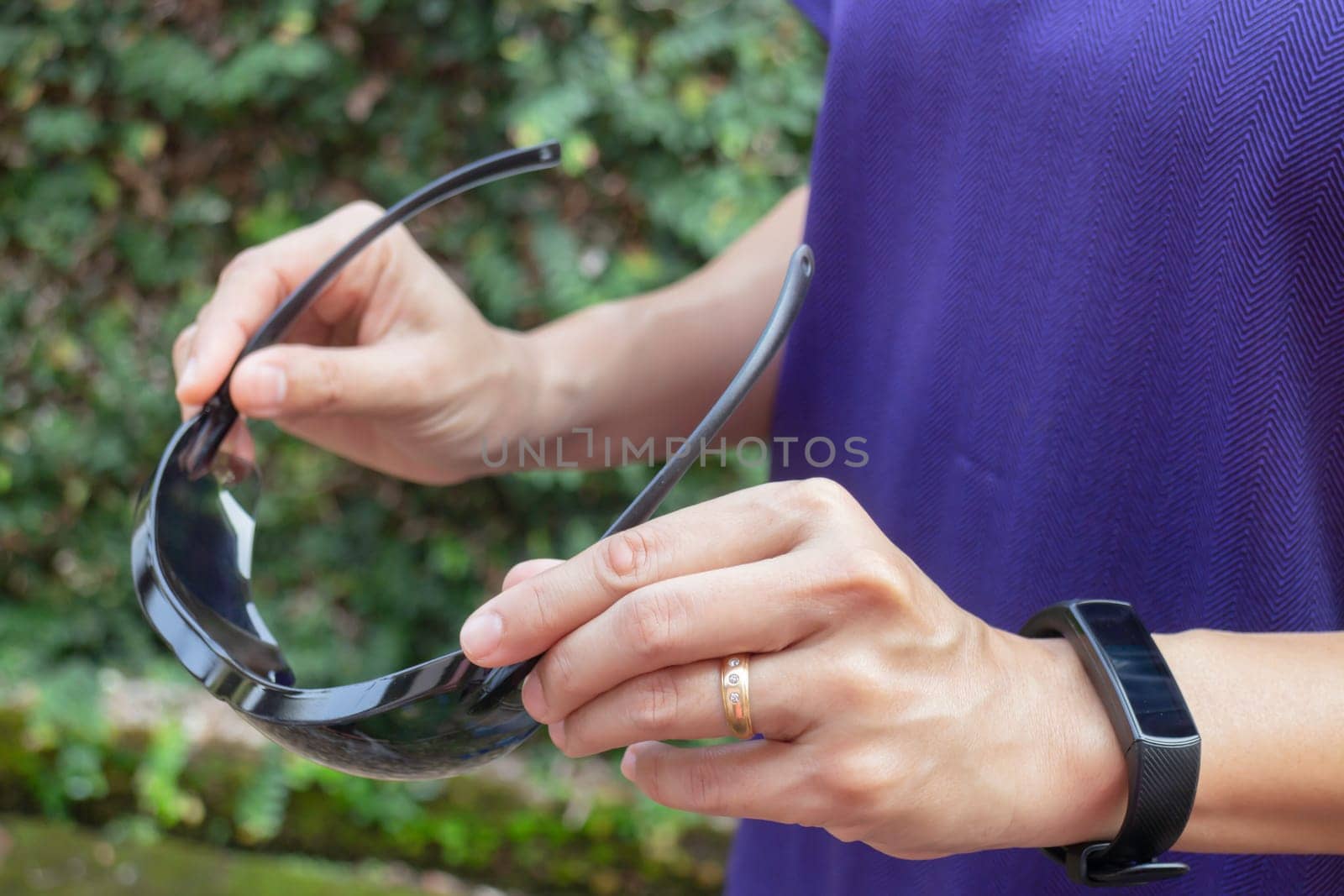 Healthy lifestyle concept female wearing sport tracker wristband arm, stock photo