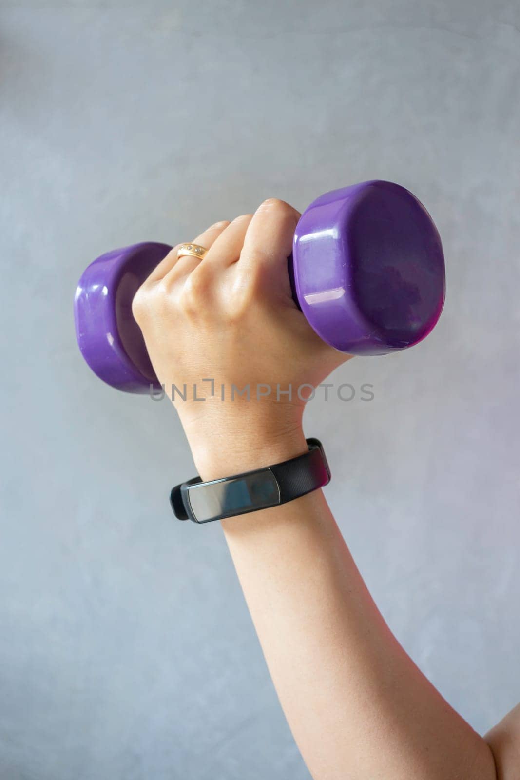 Healthy lifestyle concept female wearing sport tracker wristband arm, stock photo