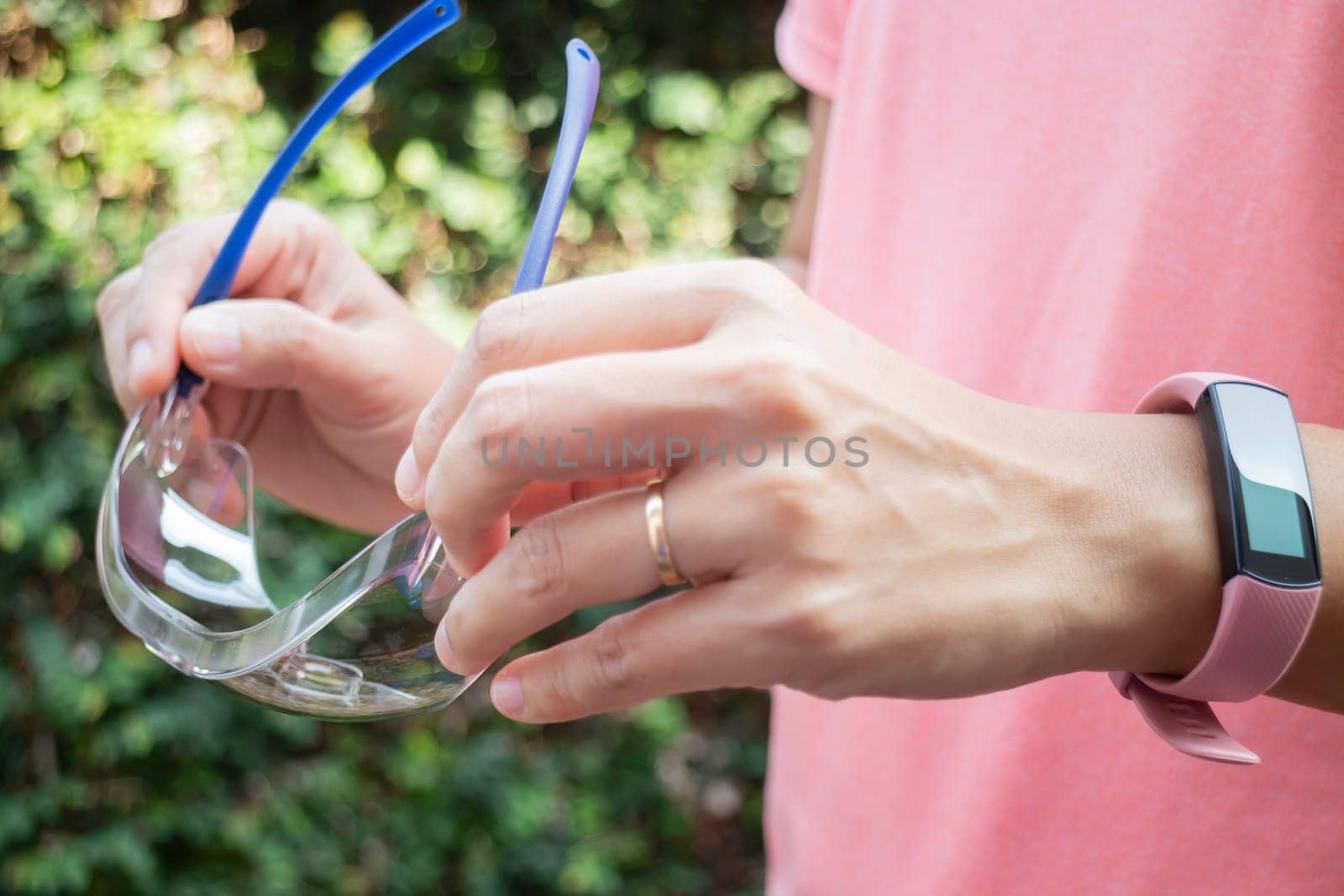 Healthy lifestyle concept female wearing sport tracker wristband arm, stock photo