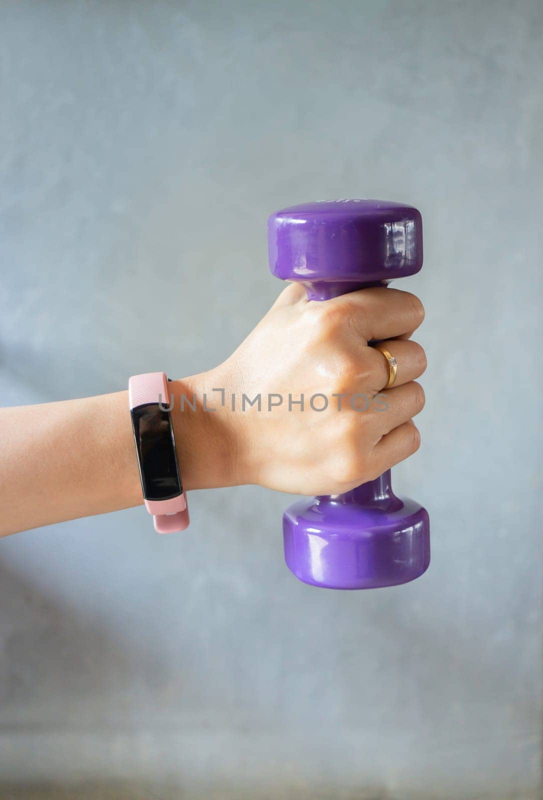 Healthy lifestyle concept female wearing sport tracker wristband arm, stock photo