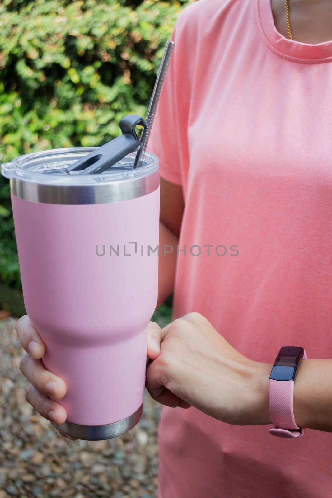Healthy lifestyle concept female wearing sport tracker wristband arm, stock photo