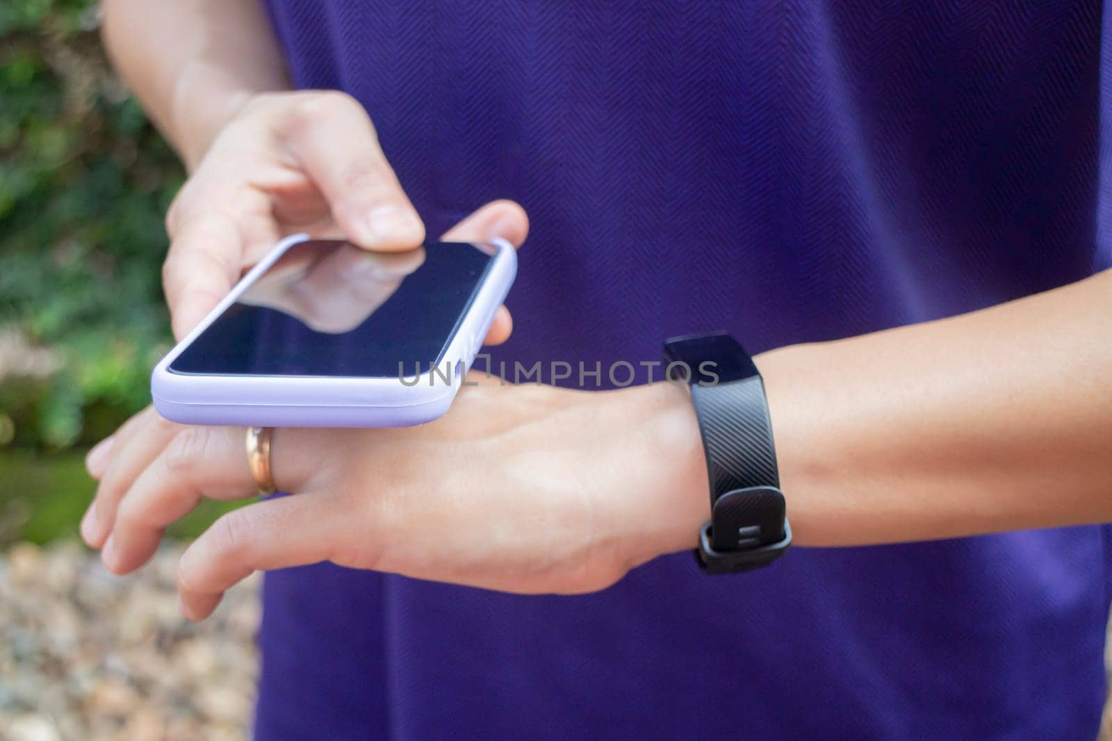 Healthy lifestyle concept female wearing sport tracker wristband arm, stock photo