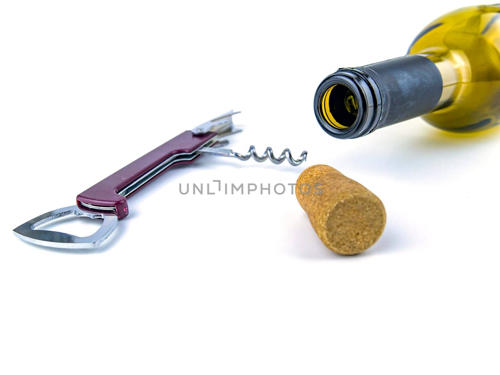 Cork from a wine bottle and a corkscrew on a white background. Place for text.