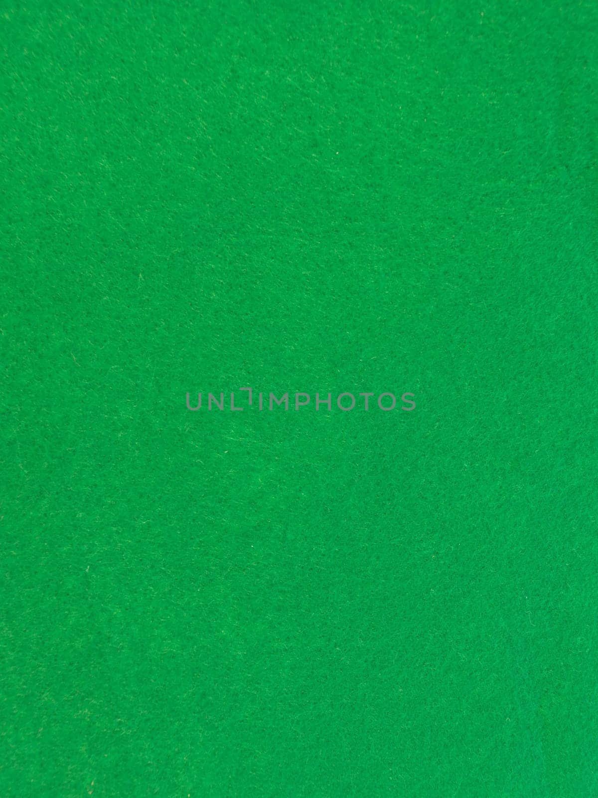 A close up shot of green felt